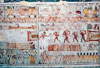 Workmen Piling up offerings at the Karnak Temple. Tomb of Neferronpet